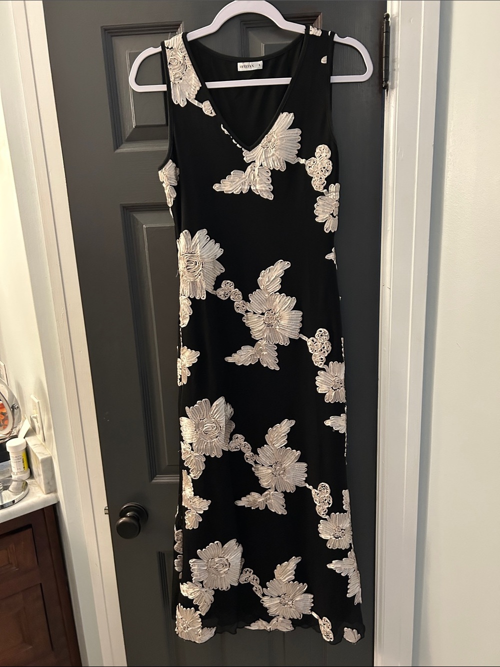 Sleeveless Black Maxi Dress with Cream Floral Appliqué